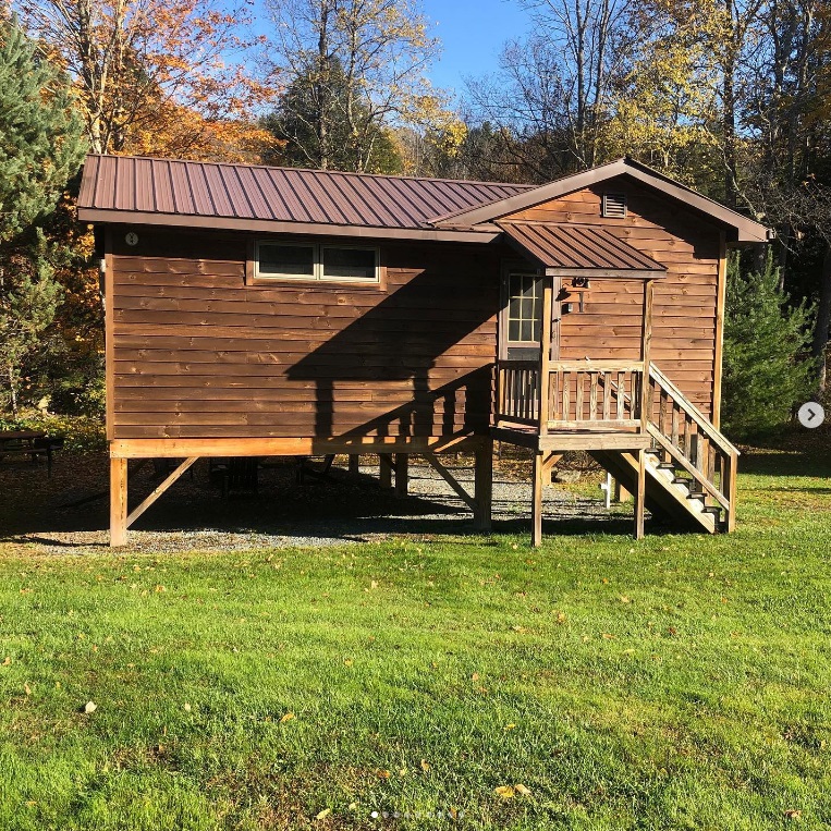 Four individual log cabins
