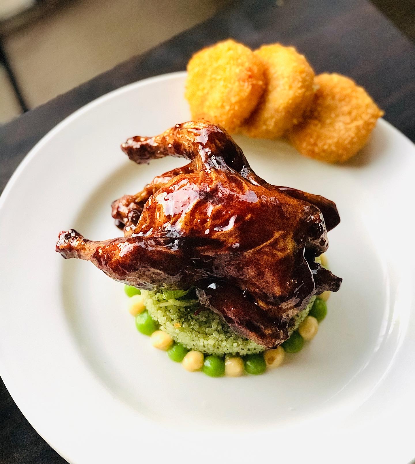 Roasted Chicken with Jade Rice, Pea Puree, and Chickpea Fritters in Lahaina